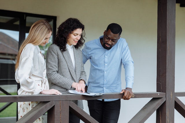a%20landlord%20going%20over%20a%20lease%20agreement%20with%20two%20tenants a%20landlord%20going%20over%20a%20lease%20agreement%20with%20two%20tenants